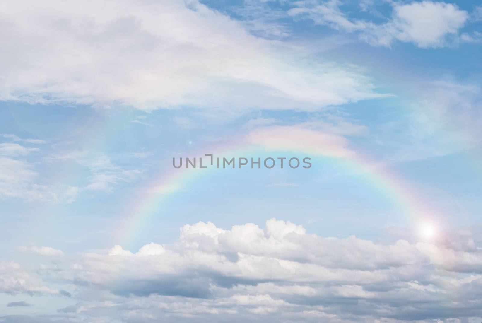 rainbow in the blue sky after the rain, for background by rakoptonLPN