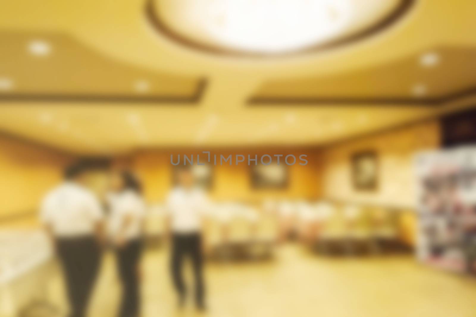 Abstract blurred people in conference room, education concept by rakoptonLPN
