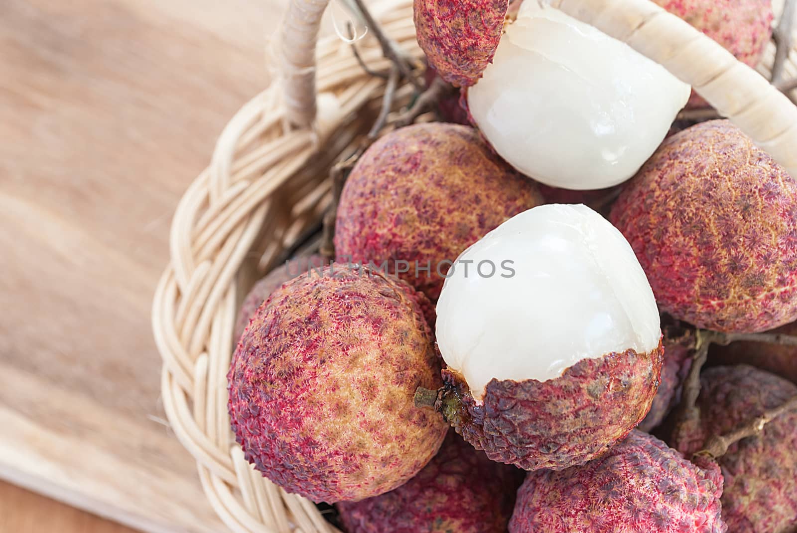Closeup of lychee fruit in basket, fruit of Asia. by rakoptonLPN