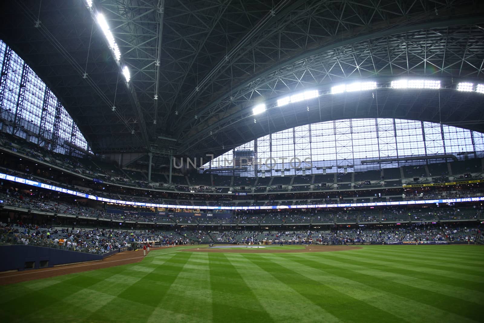 Brewers fans await a baseball game at Miller Park against the Chicago Cubs under a closed dome.