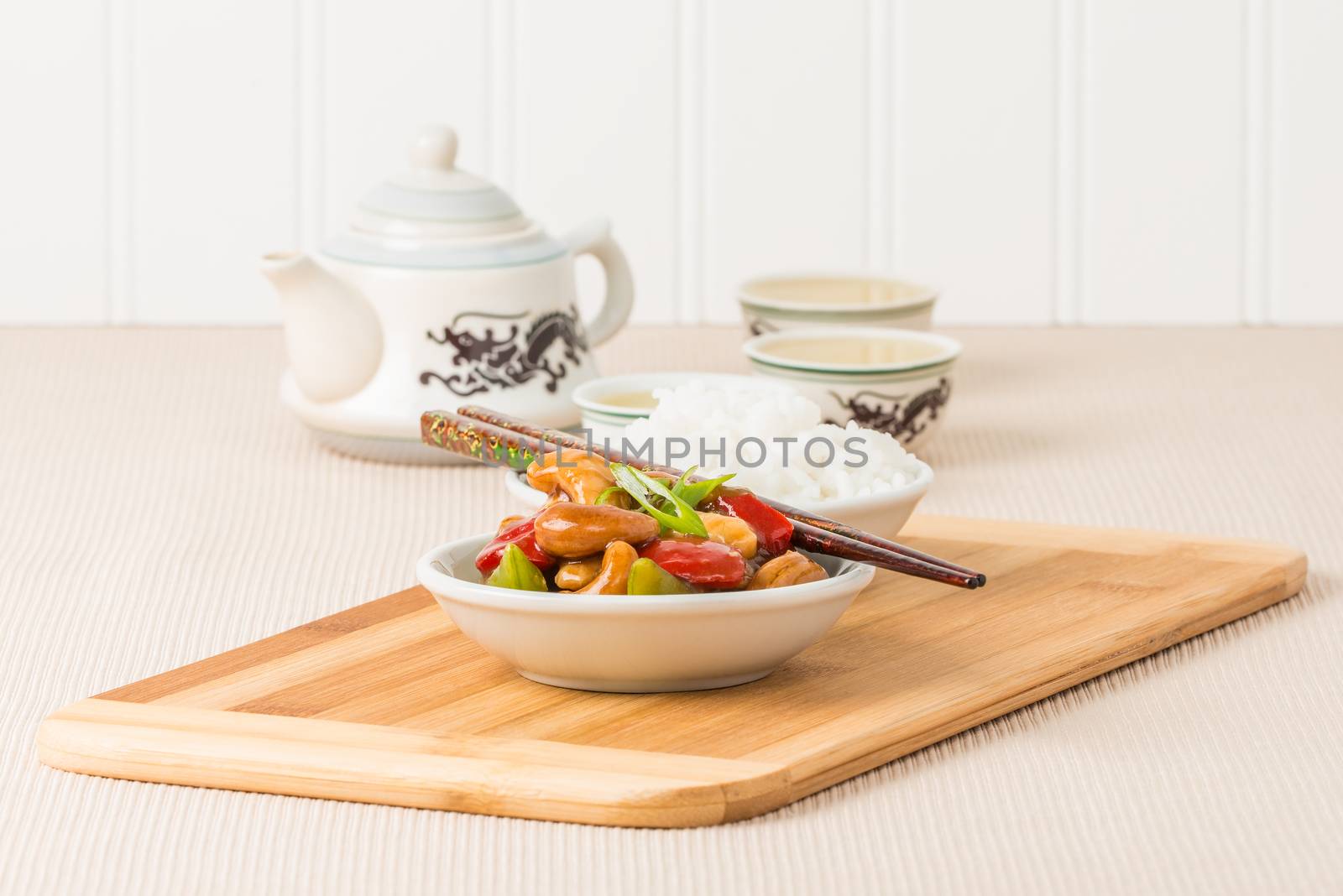 Bowl of Chinese cashew chicken served with white rice.