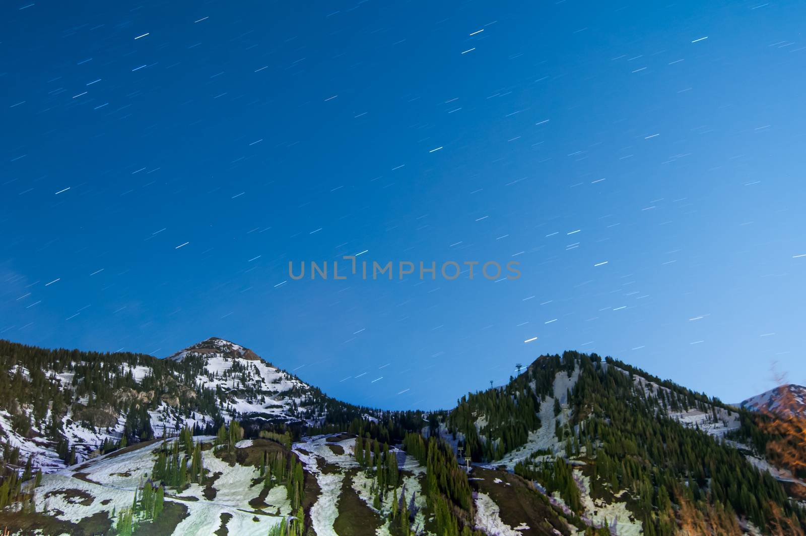 Star trails above a mountain near the base of Snowbird Utah