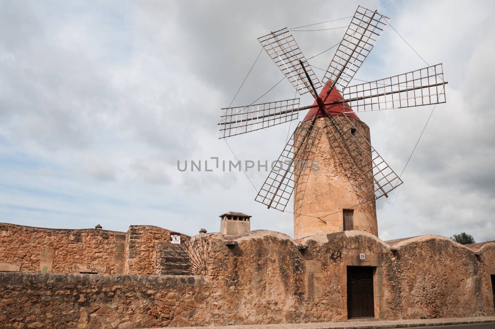 Windmill in a village in Mallorca by Mariamarmar
