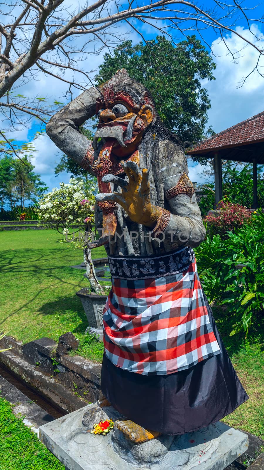 Statue of the god at the entrance to a temple in Bali, Indonesia