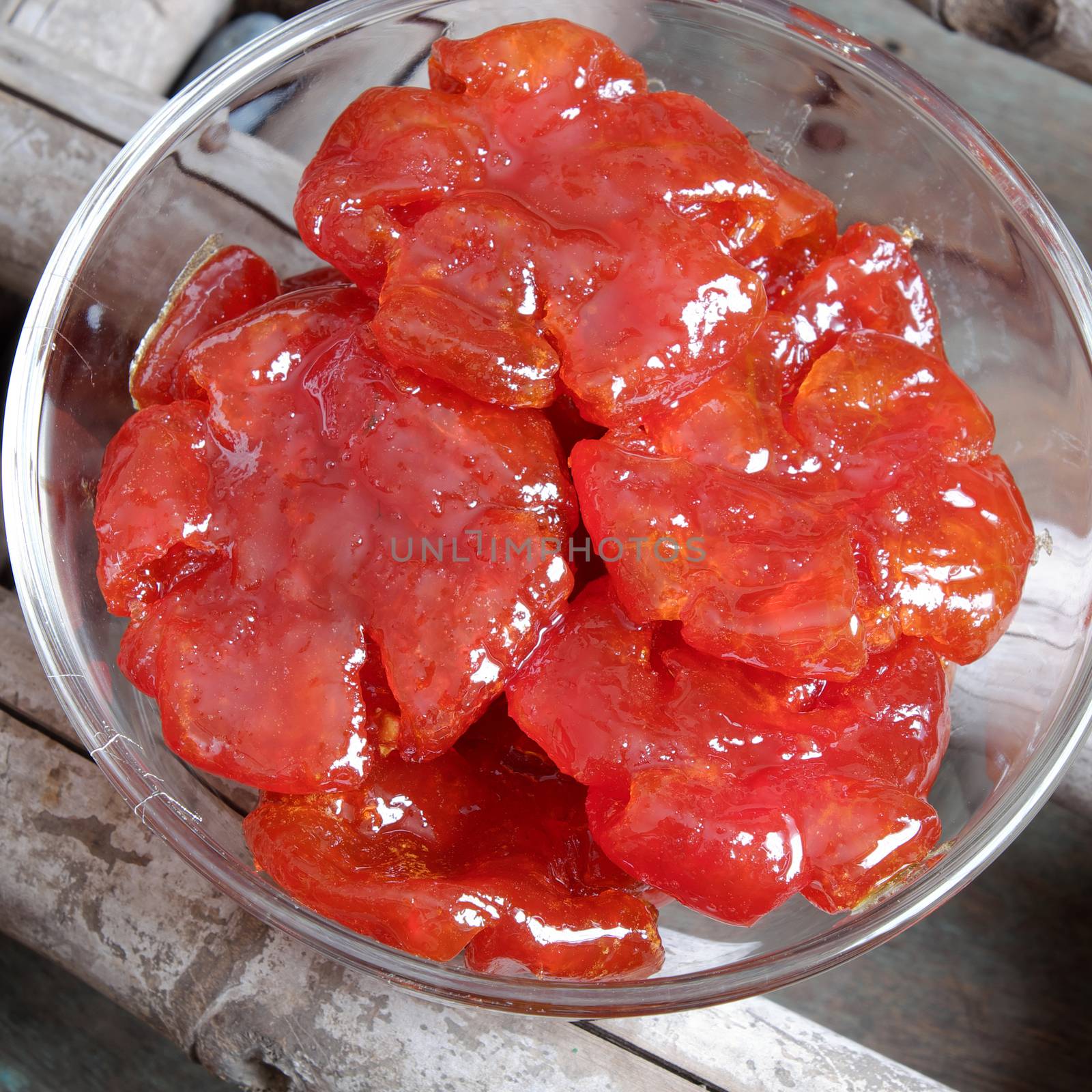Vietnamese food for Tet holiday in spring, tomato jam, sweet eating is traditional food on lunar new year, can make from tomato cook with sugar,  amazing background for Vietnam custom
