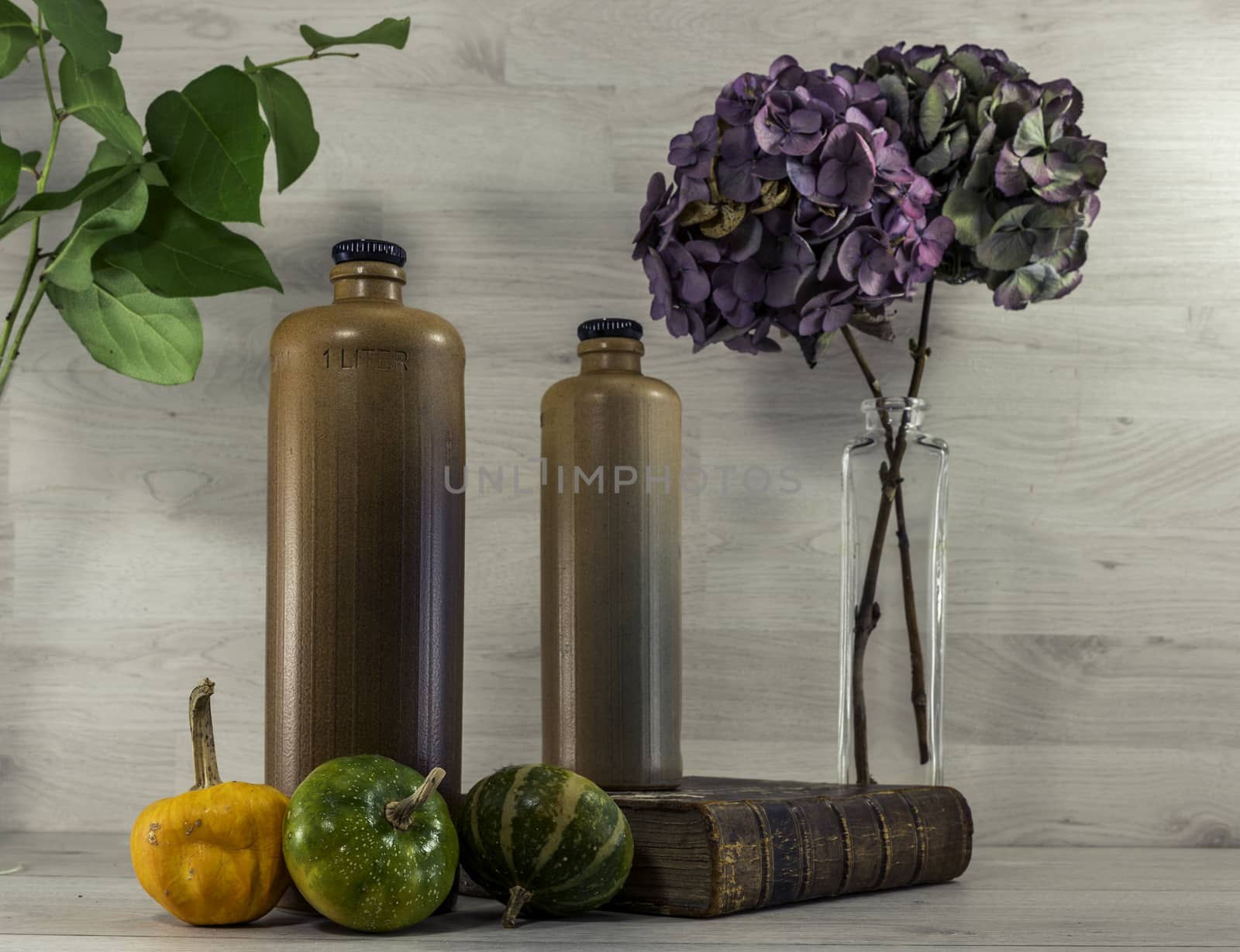 stil life  with stone bottles on wooden background