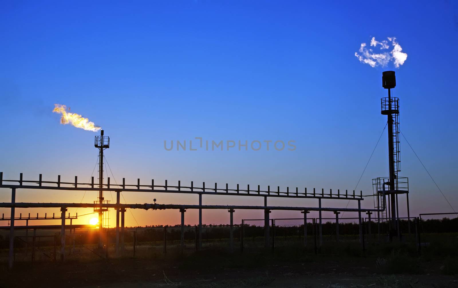 Torches for casing-head gas flaring during oil at sunset