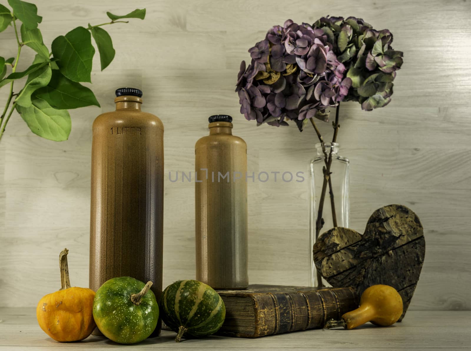 still life  with stone bottles on wooden background
