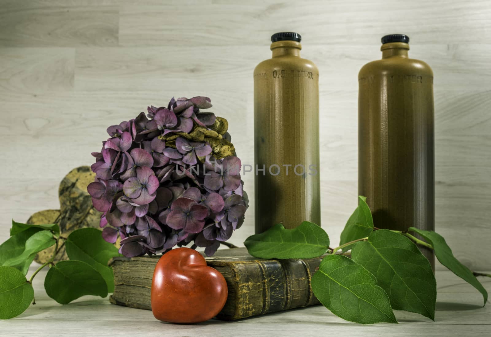 stil life  with stone bottles on wooden background