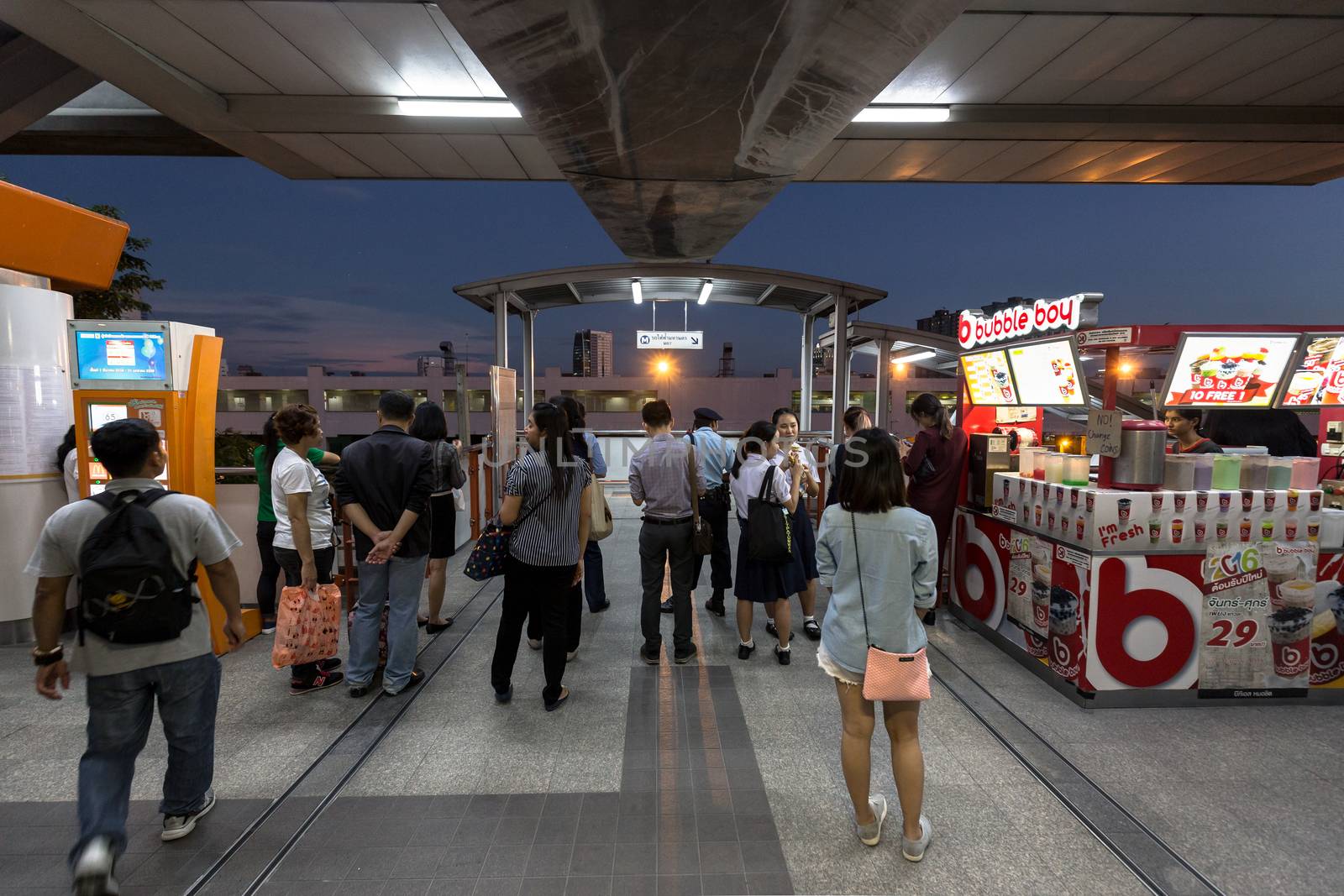 Bangkok, Thailand - January 18, 2016 : People waiting to go out of the BTS Mo Chit station at night because of some accident outside. Daily passengers of BTS skytrain is around 700,000.