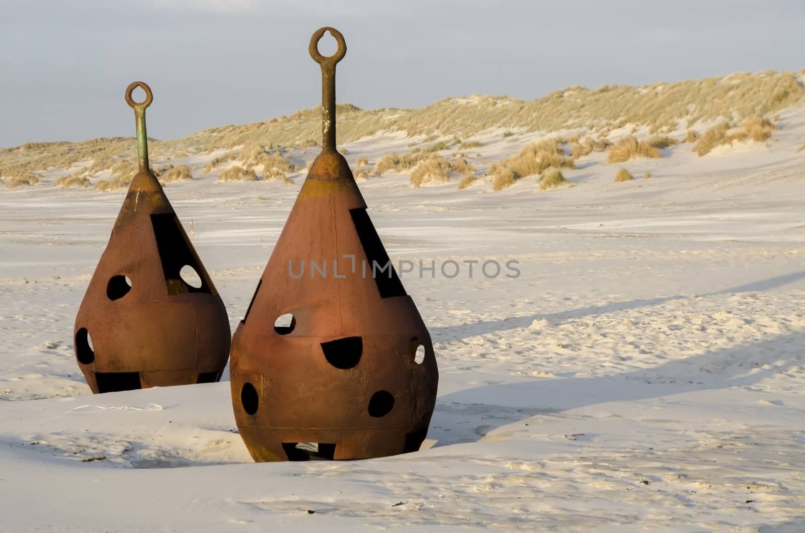 Old rusted shackles on the beach at Terschelling in the Netherlands
