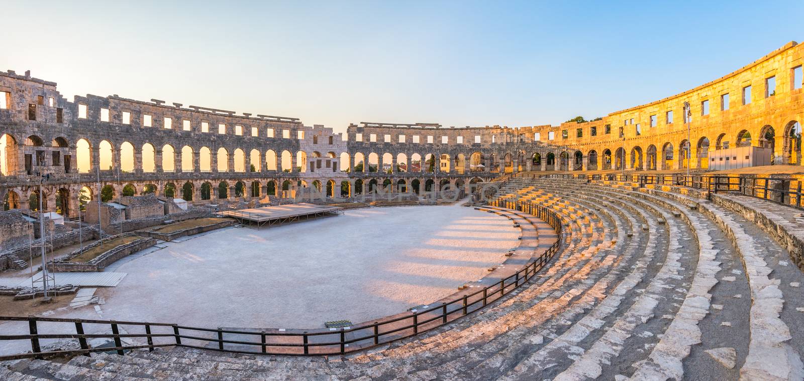 Inside of Ancient Roman Amphitheater in Pula, Croatia, Famous Travel Destination, in Sunny Summer Evening