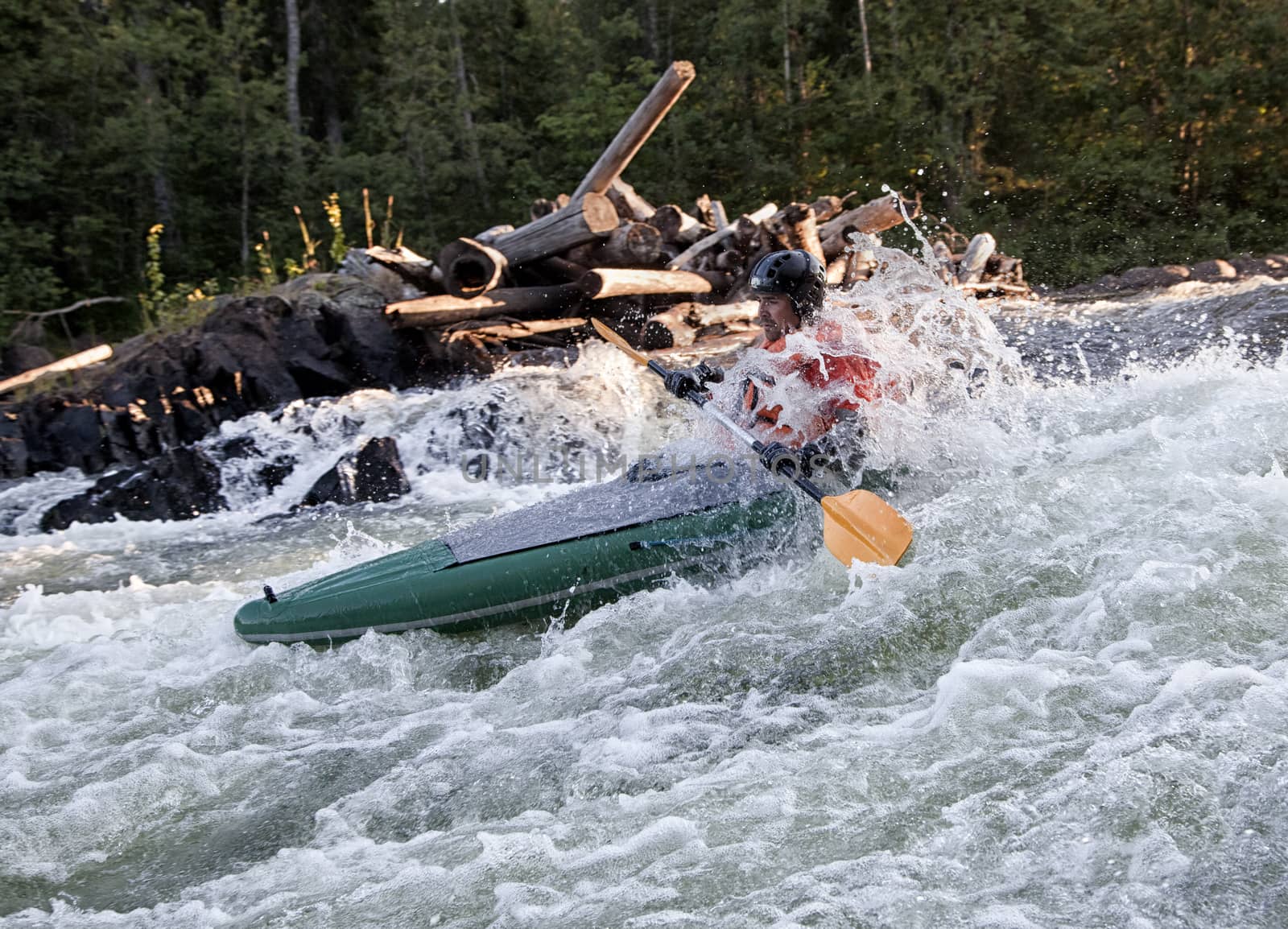 Kayaker in whitewater by Goodday