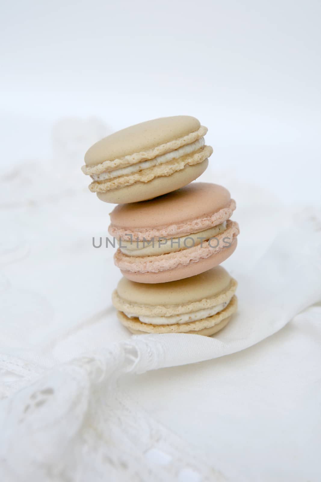Macaron is a sweet dessert made from polymer mixtures rack sink with egg whites, icing sugar, white sugar, almond powder or almond meal. And food coloring Macaron shape sandwich A splice two pieces of bread Have stuffed the middle