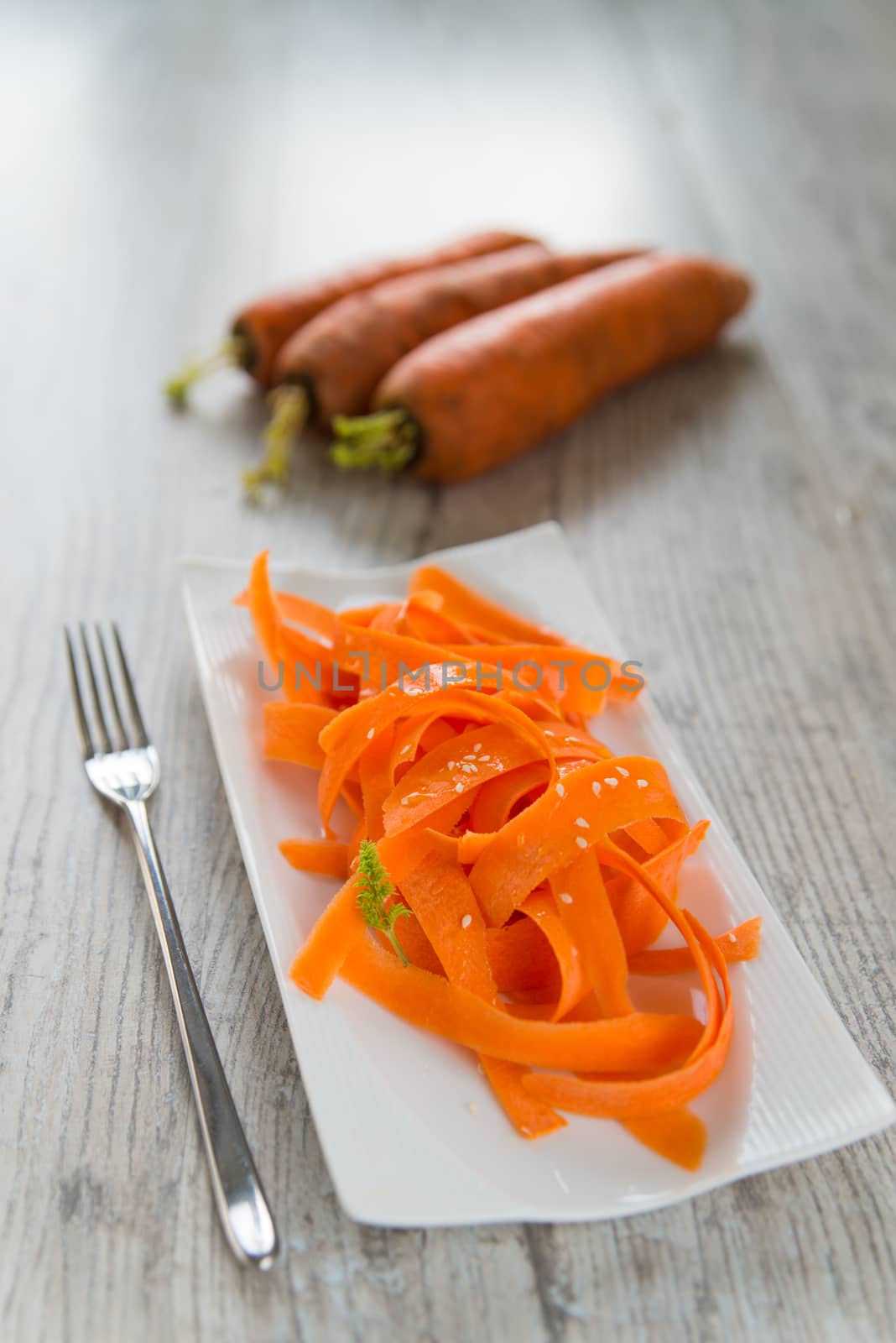 Vitamin carrot salad on the white plate