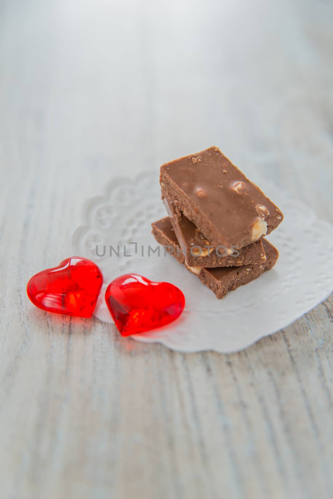 Chocolate and two red hearts by Linaga