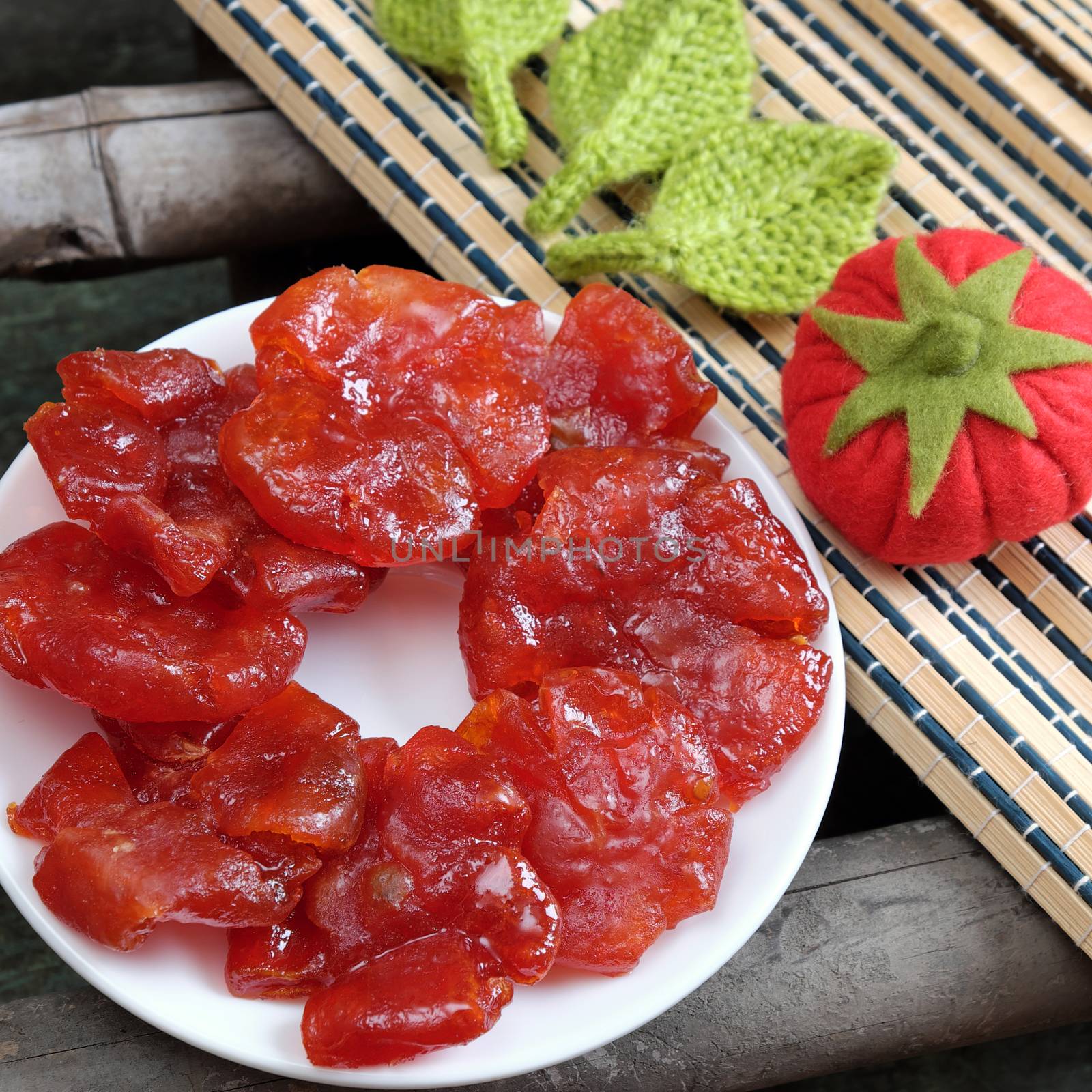 Vietnamese food for Tet holiday in spring, tomato jam, sweet eating is traditional food on lunar new year, can make from tomato cook with sugar,  amazing background for Vietnam custom