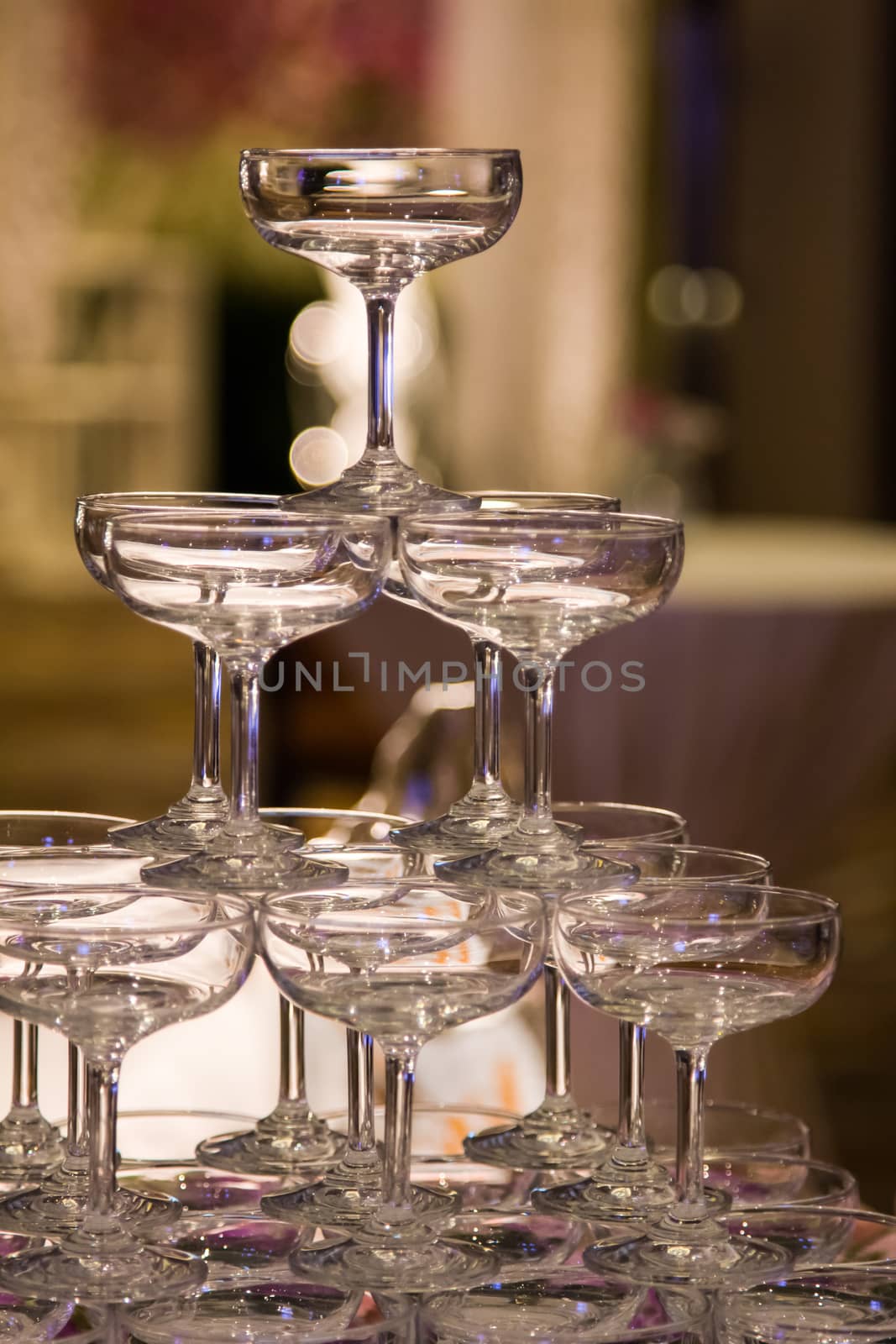 Stack of champagne glasses by liewluck