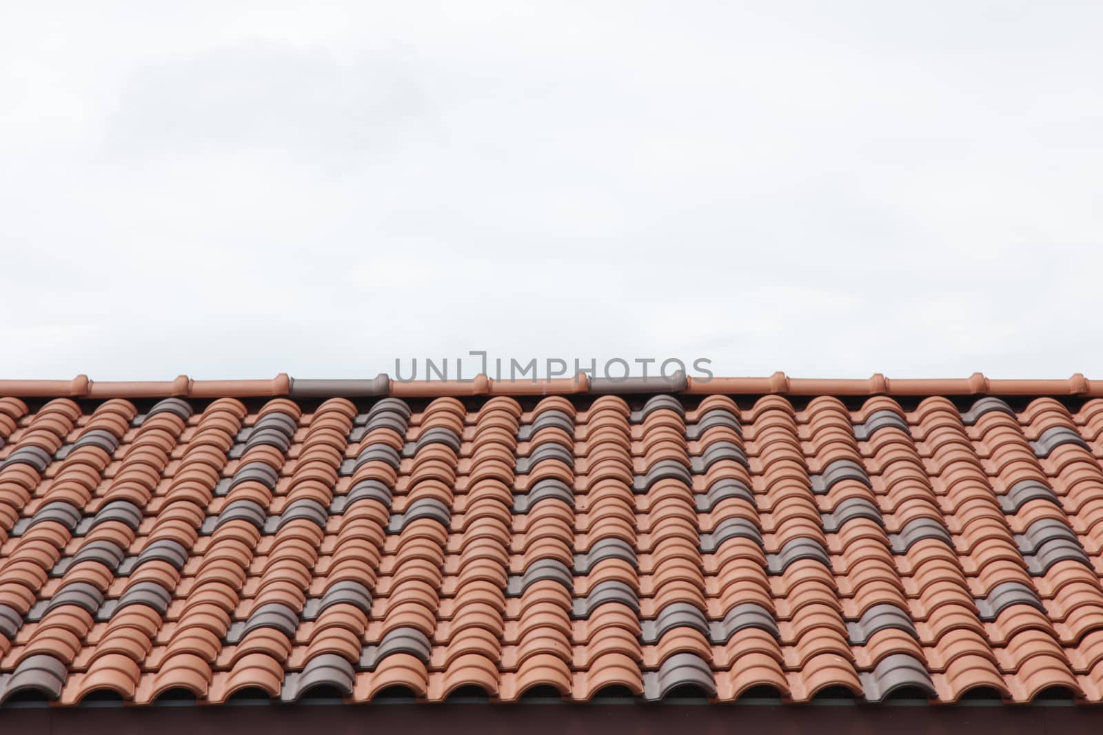 Close up red roof top with sky