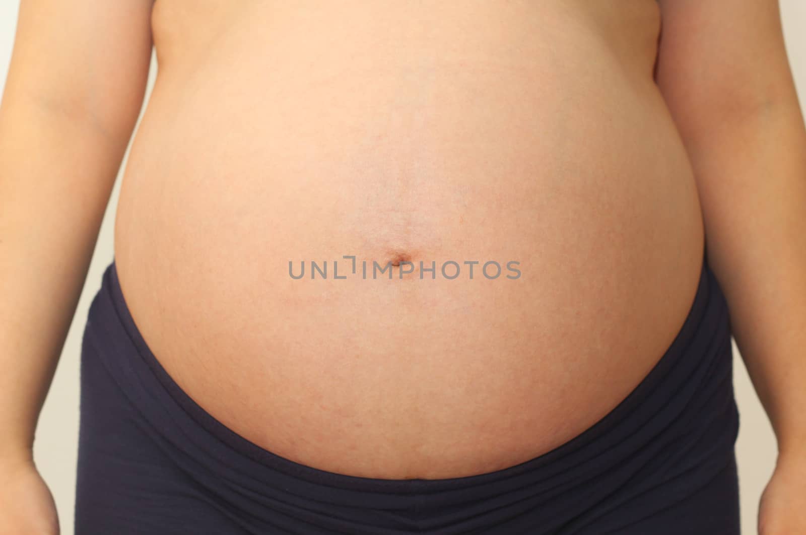 Photo of a cute pregnant woman belly