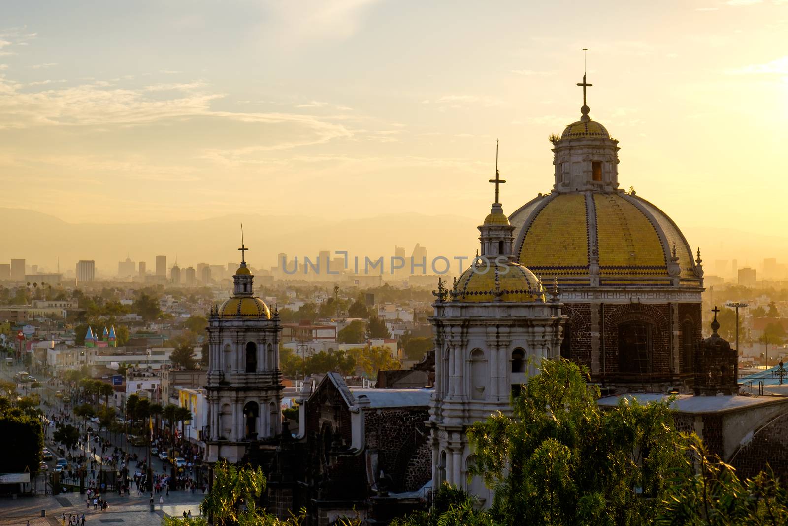 Scenic view at Basilica of Guadalupe with Mexico city skyline at sunset, Mexico