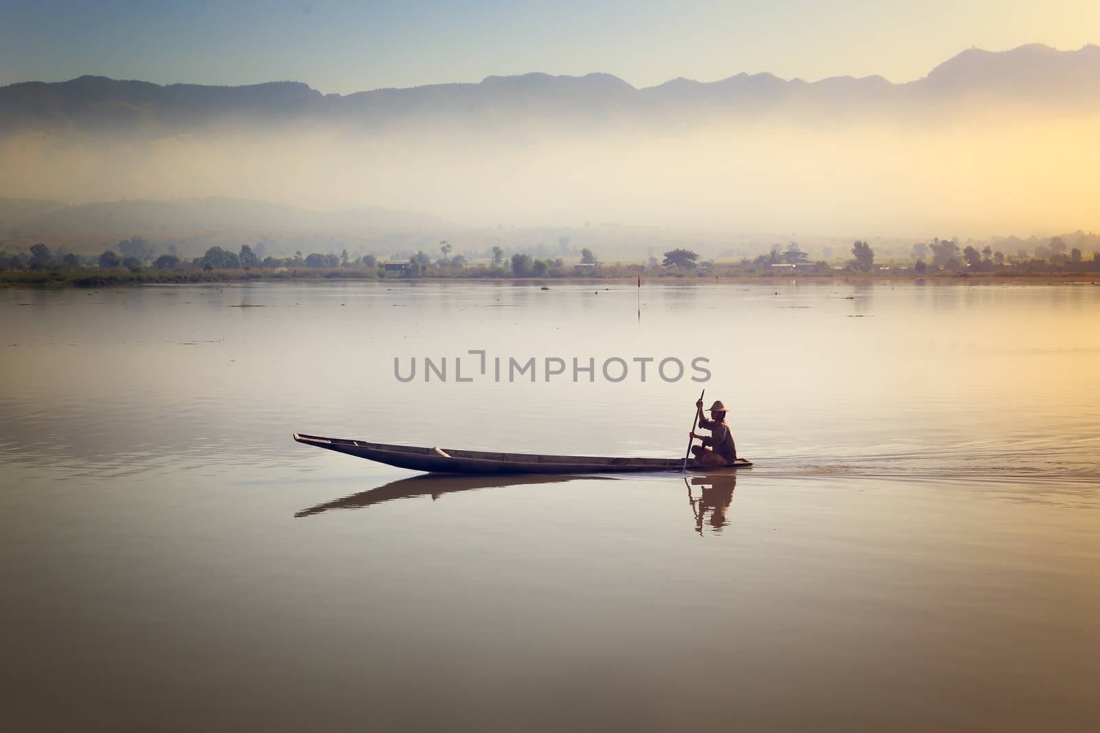  Fisherman fishing at sunrise in Myanmar. by devy