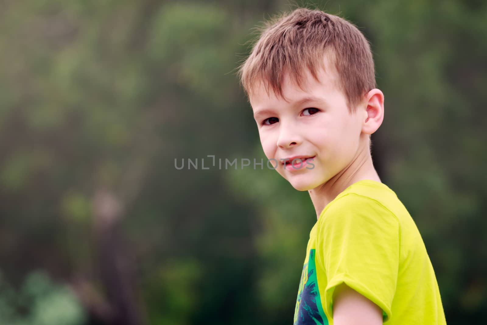 Outdoors portrait of a young boy  by davidhewison