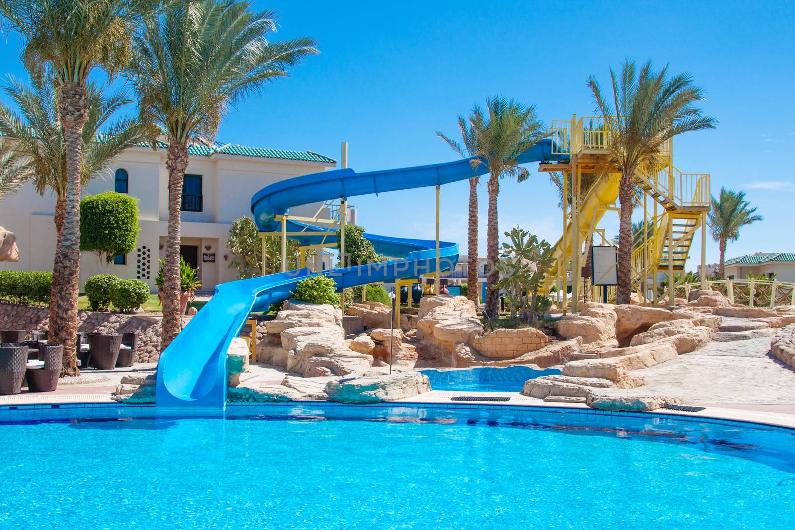 Sharm El Sheikh, Egypt - circa april, 2015: Egyptian hotel resort and spa view with palm trees, swimming pool and blue sky