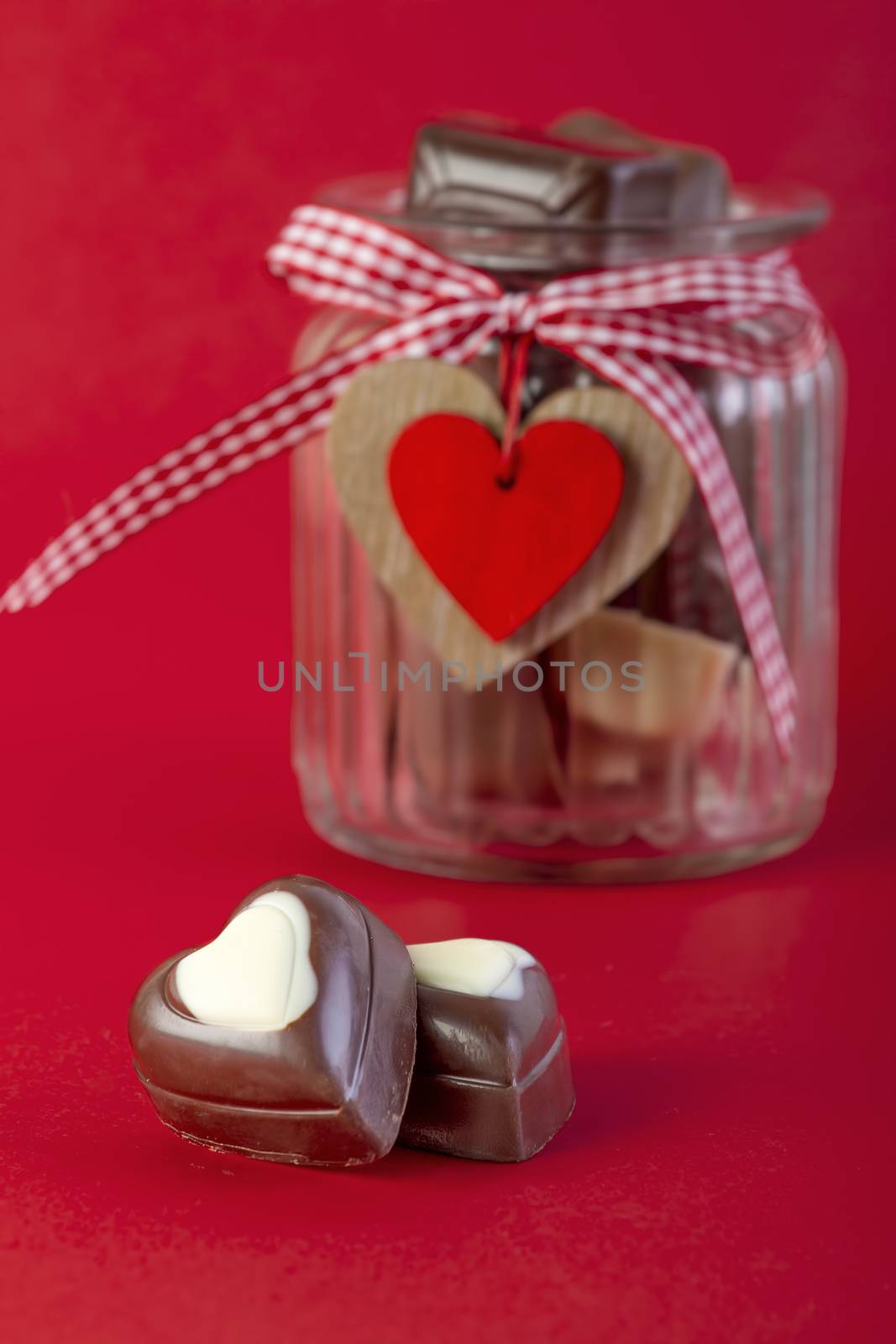 Chocolates in a jar. Valentines day concept by manaemedia