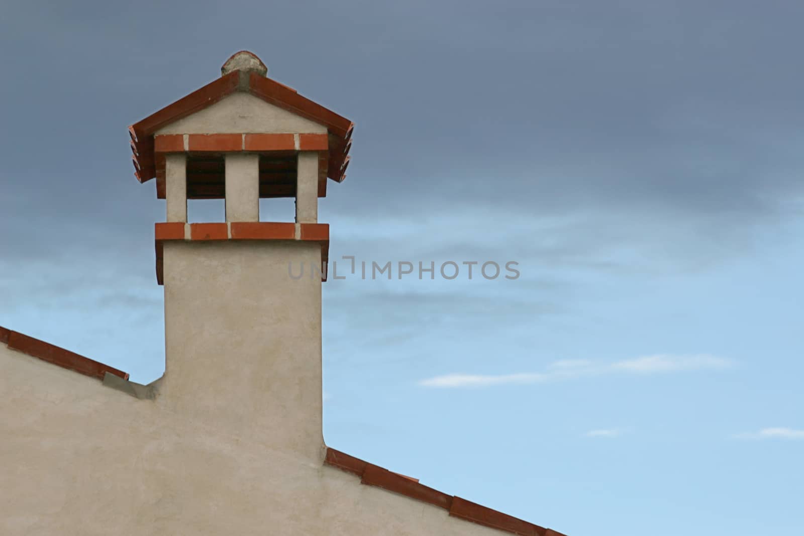 Chimney and cloudy sky