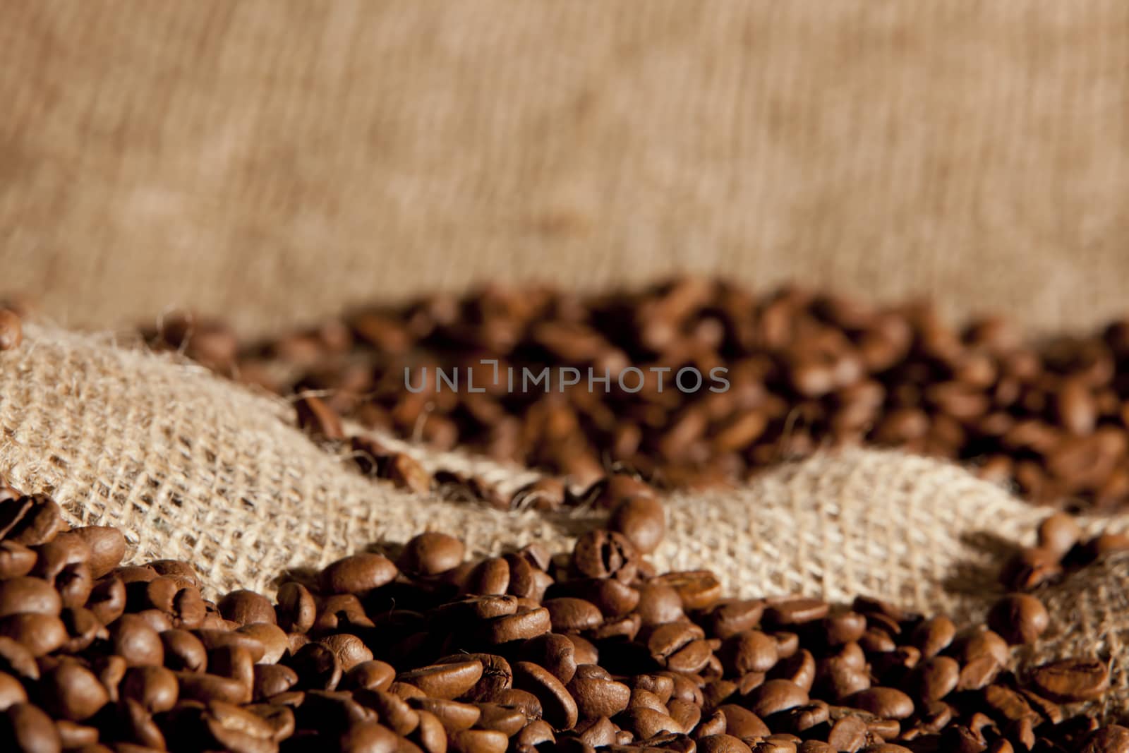 Coffee beans on a sack for background