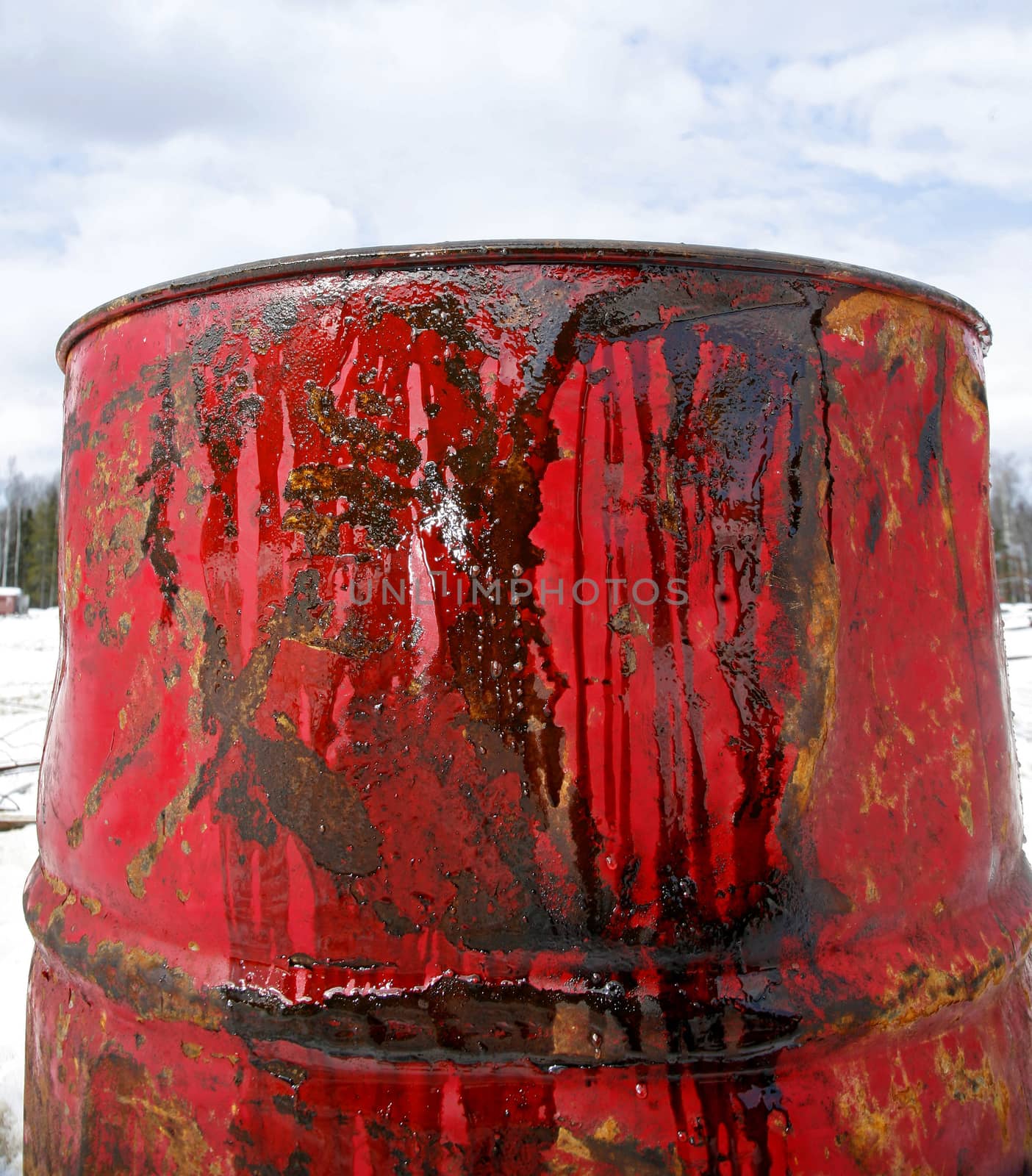 Close up oil in red barrel on the background of blue sky