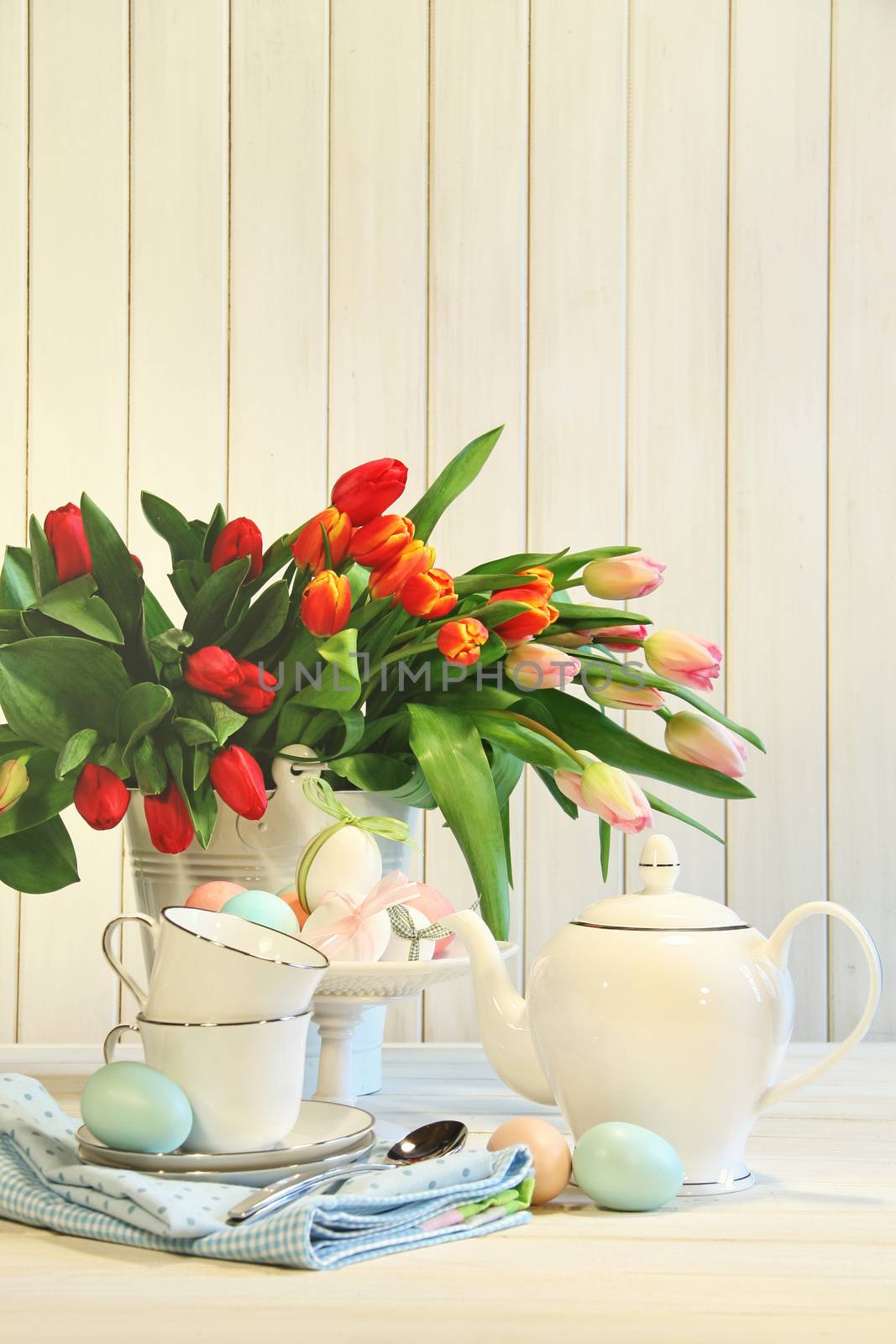 Tulips and colored eggs for Easter