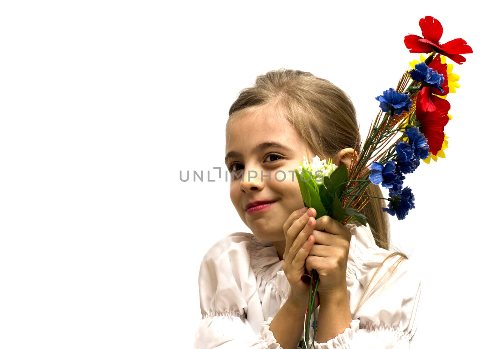 smiling little girl with a bouquet of flowers isolated on a white background
