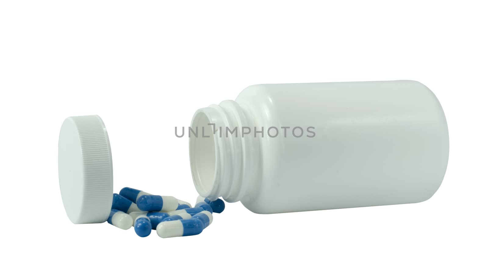 some pills of a white and blue colors with white jar on a white background