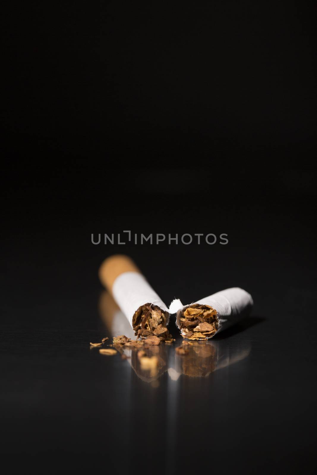 closeup broken cigarette, stop smoking by CatherineL-Prod