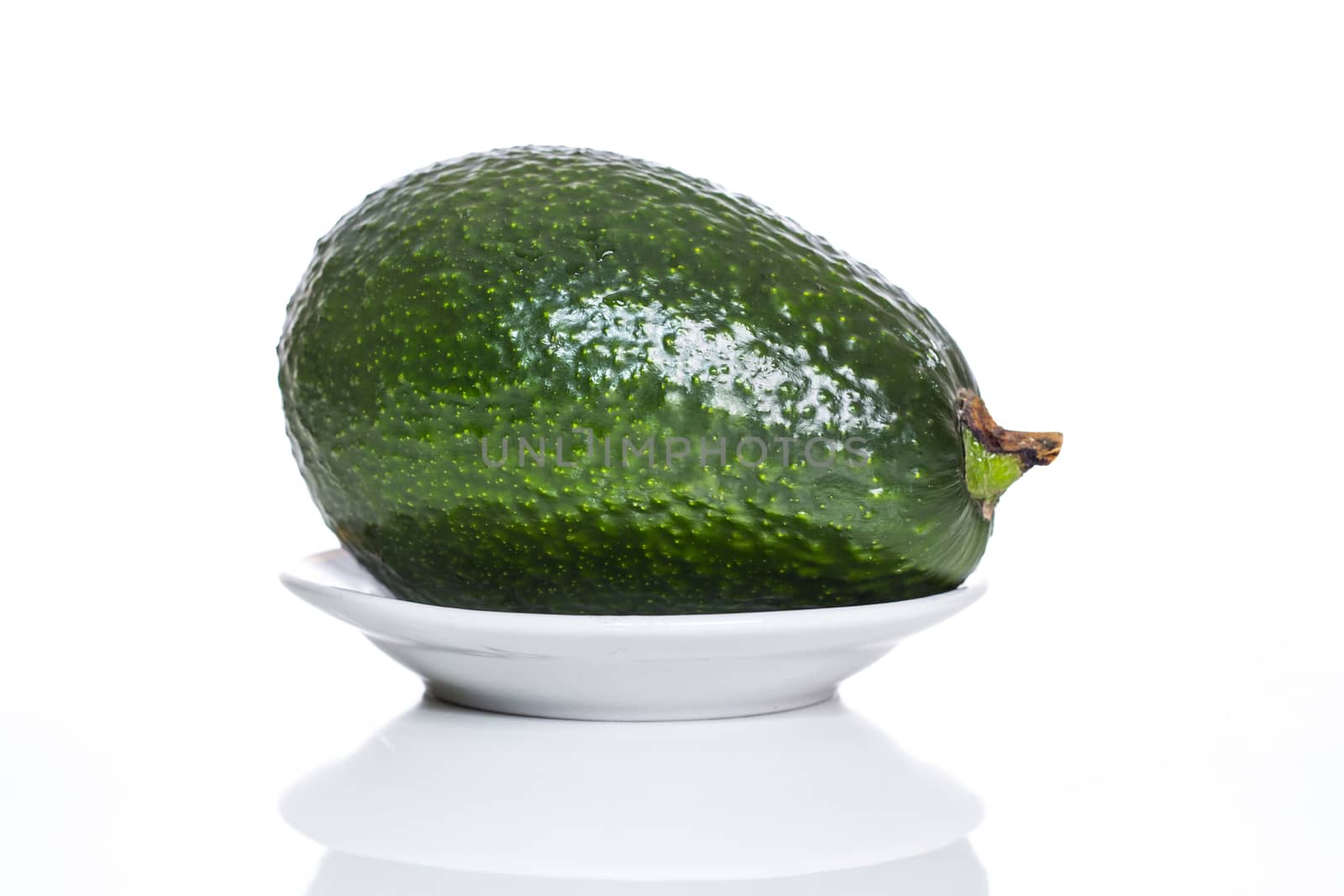 avocado on a plate by aziatik13