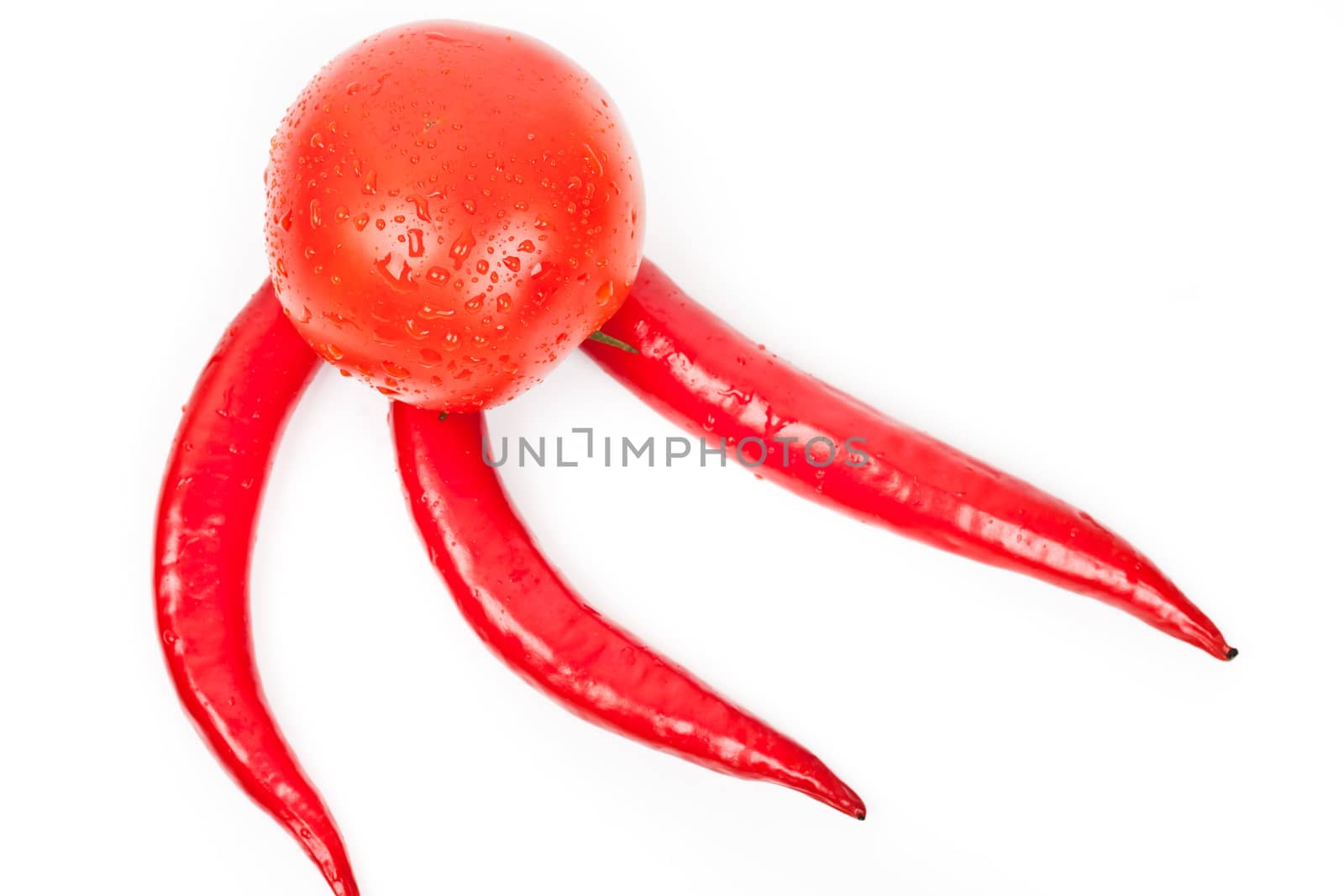 tomatoes and hot peppers on a white background