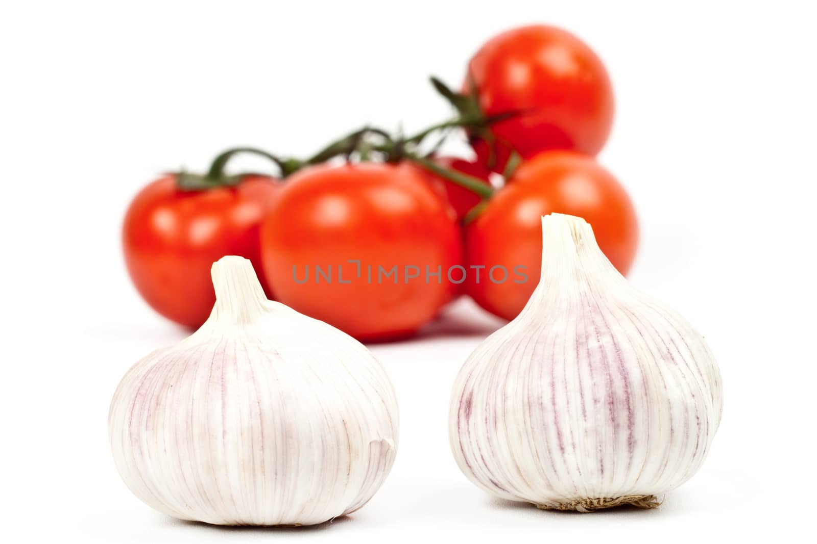 tomatoes and garlic on a light background