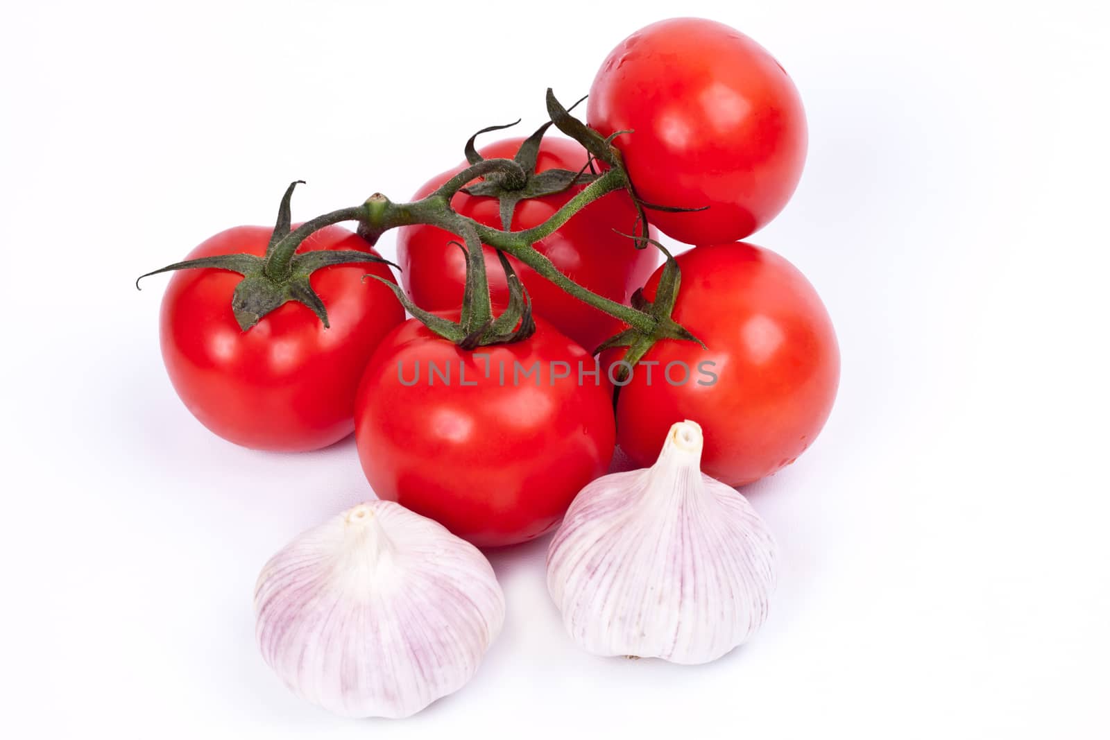 tomatoes and garlic on a light background