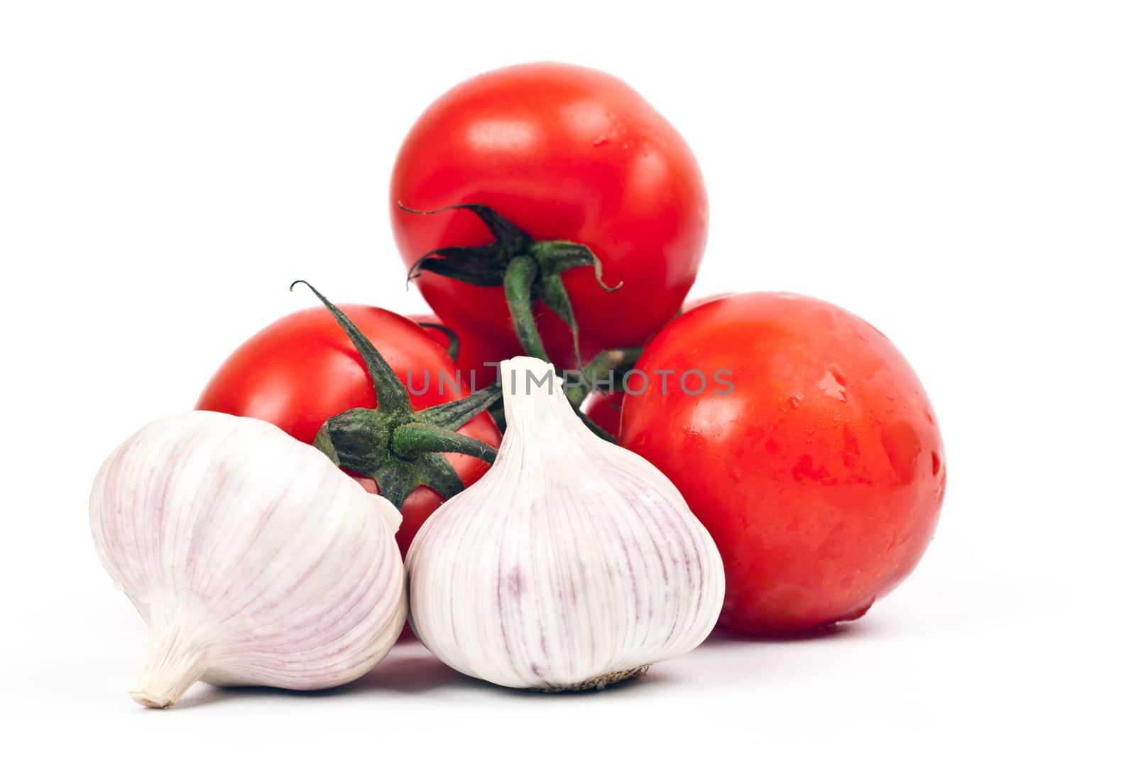 tomatoes and garlic on a light background