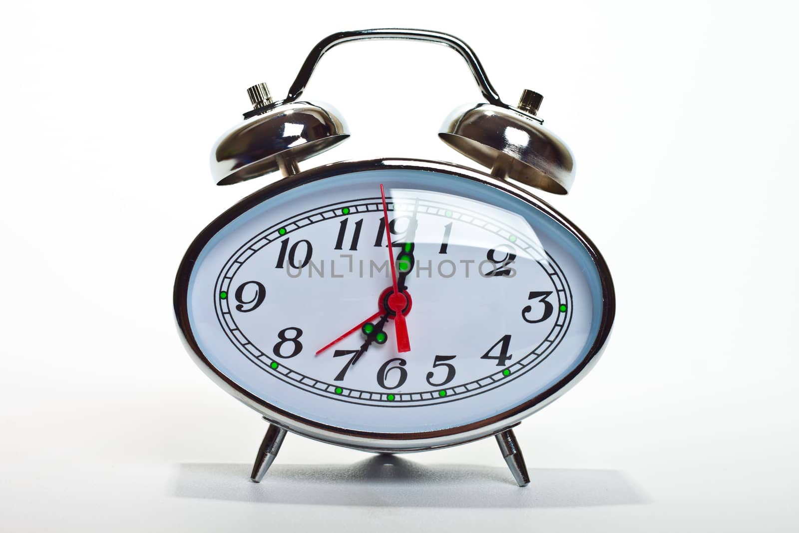 Alarm clock, isolated on the white background, clipping path included.