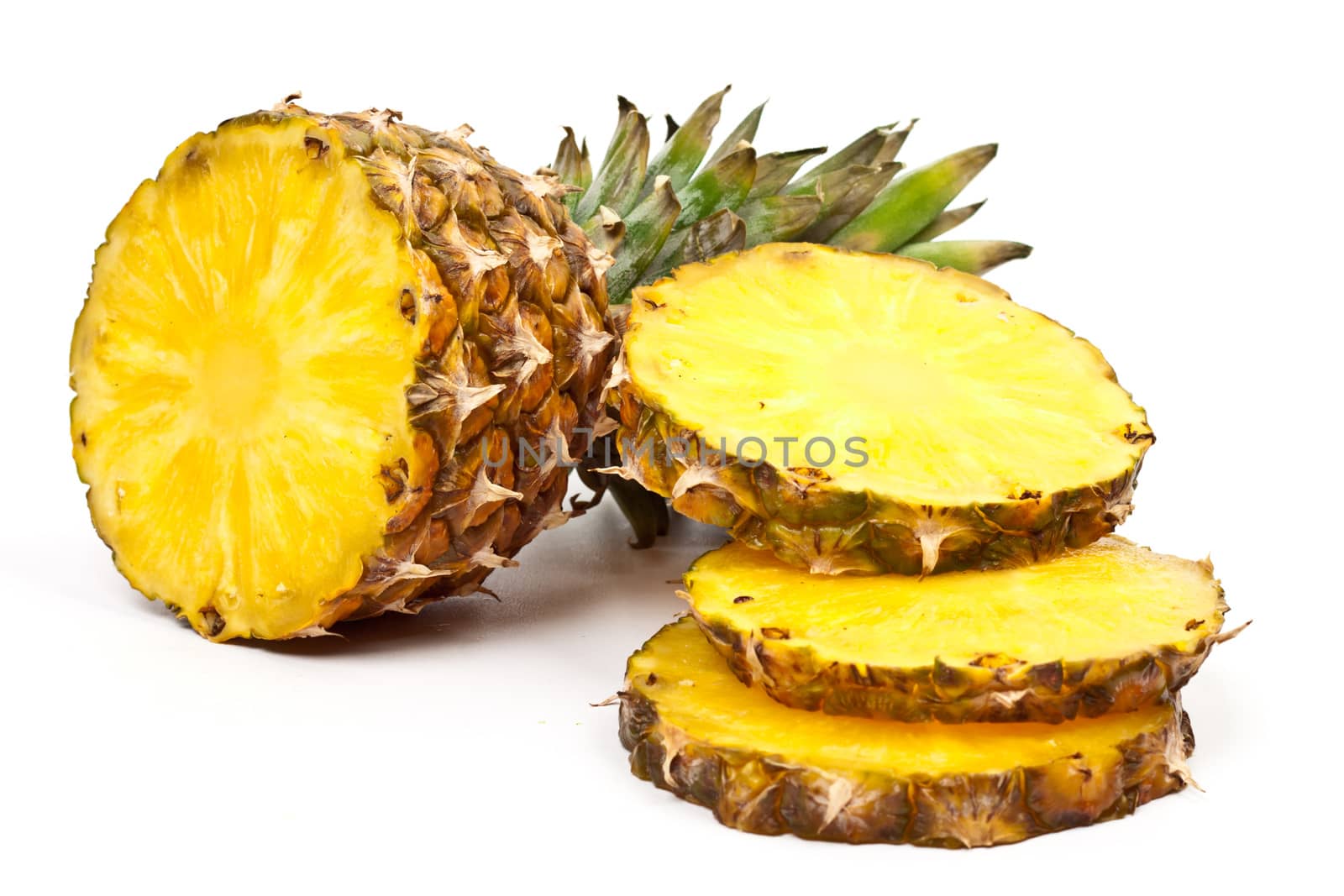 ripe pineapple sliced ​​on a light background