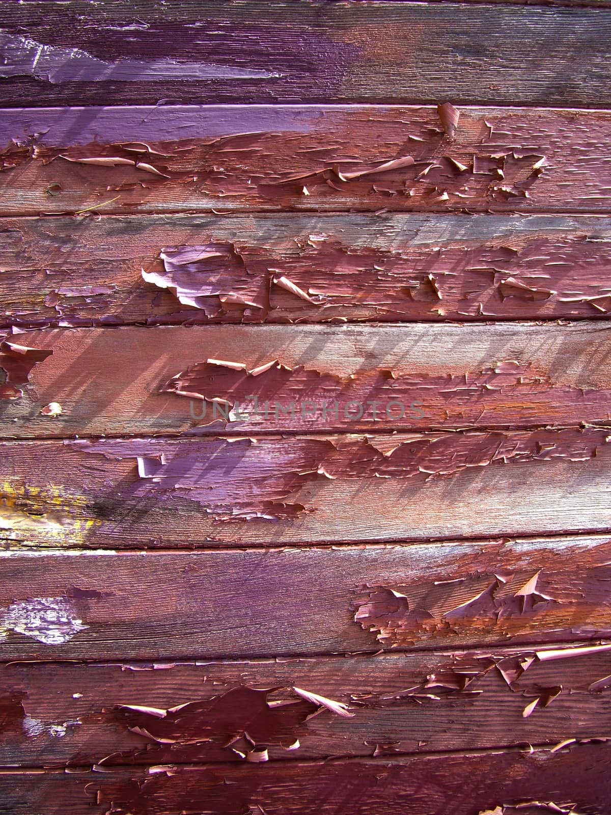 Peeling paint on old wood planks