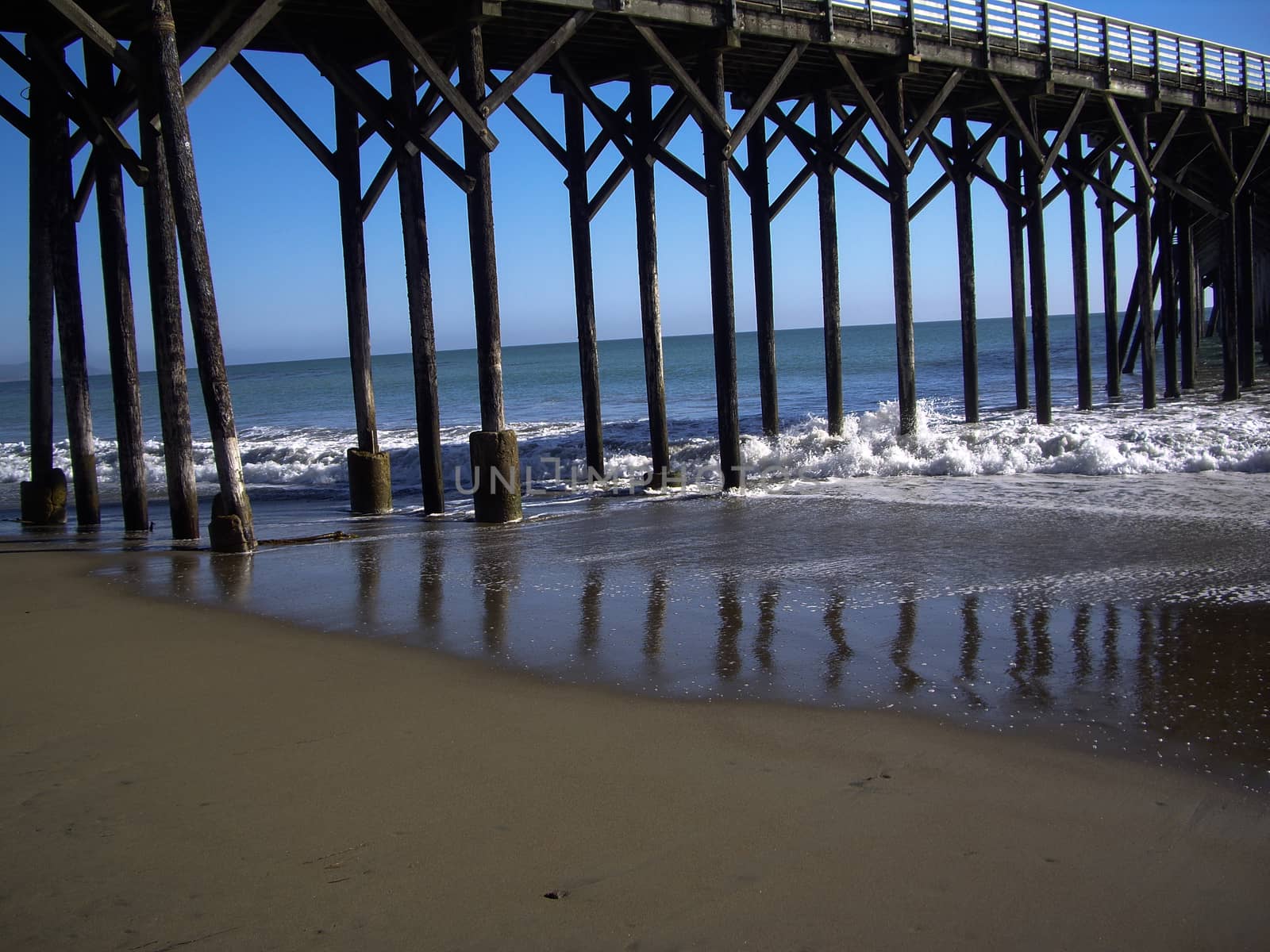 Wooden structure of pier in California by emattil
