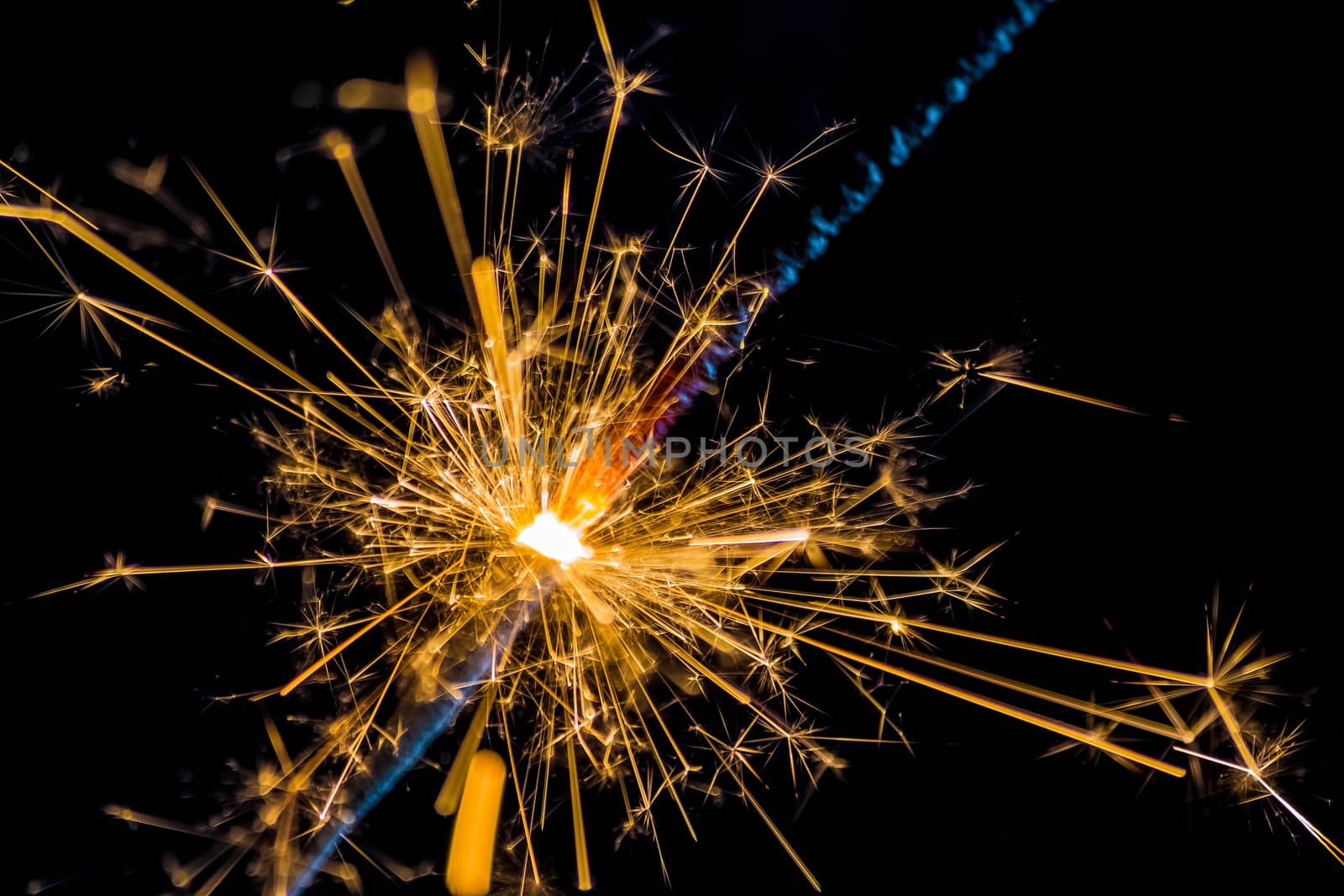 firework sparkler burning on black background, congratulation greeting  party happy new year,  christmas celebration by donfiore