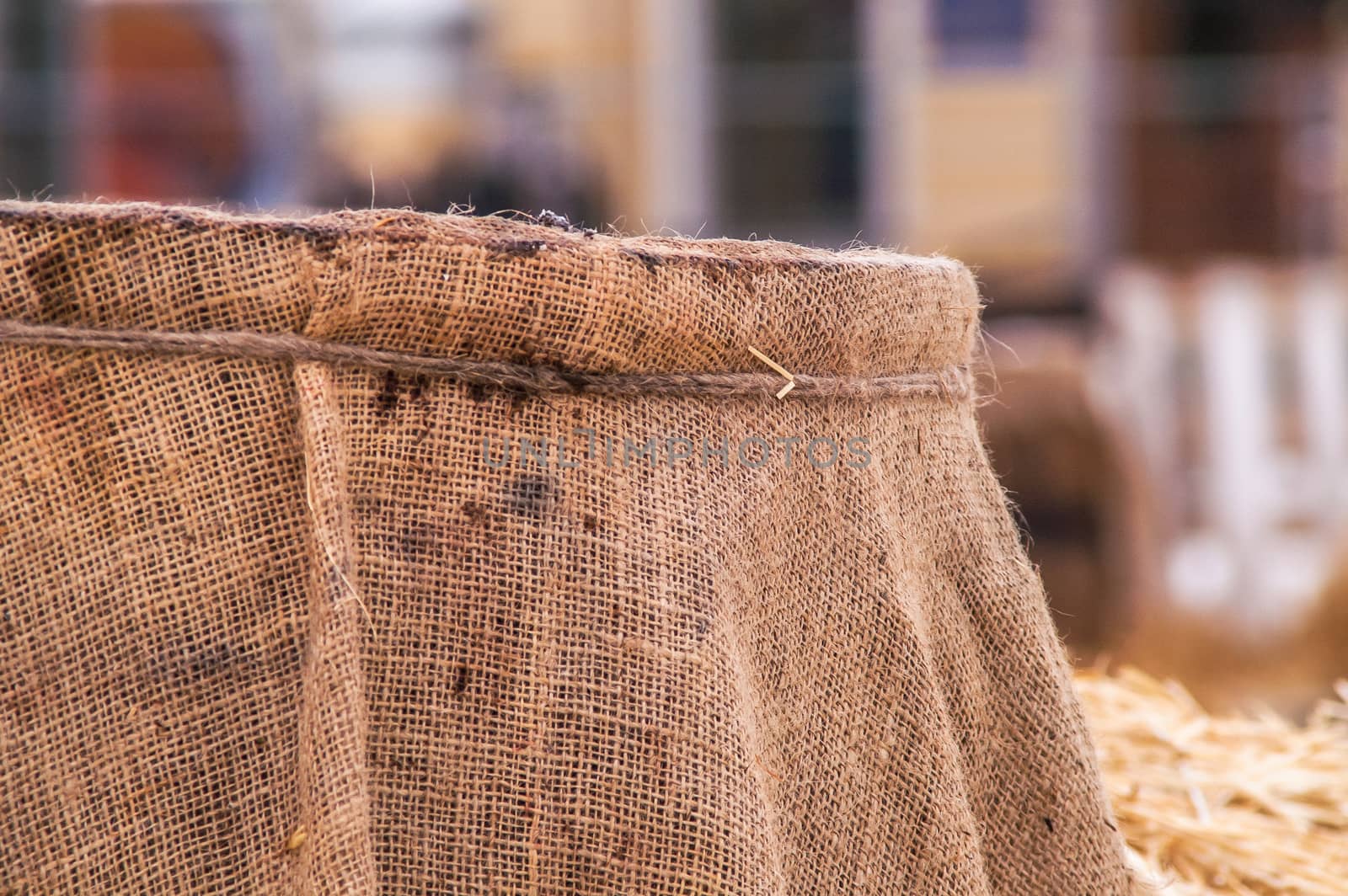 wooden barrel near the straw on the snow