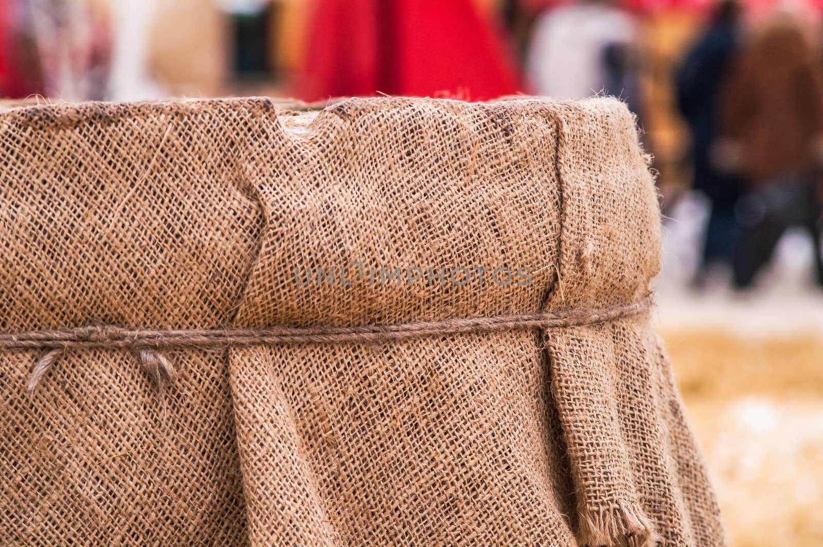 wooden barrel near the straw on the snow