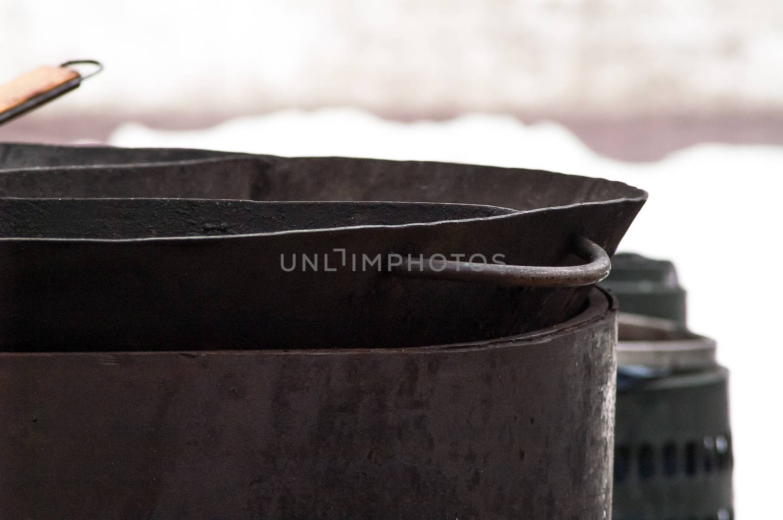 big metal frying pan for cooking in the field field