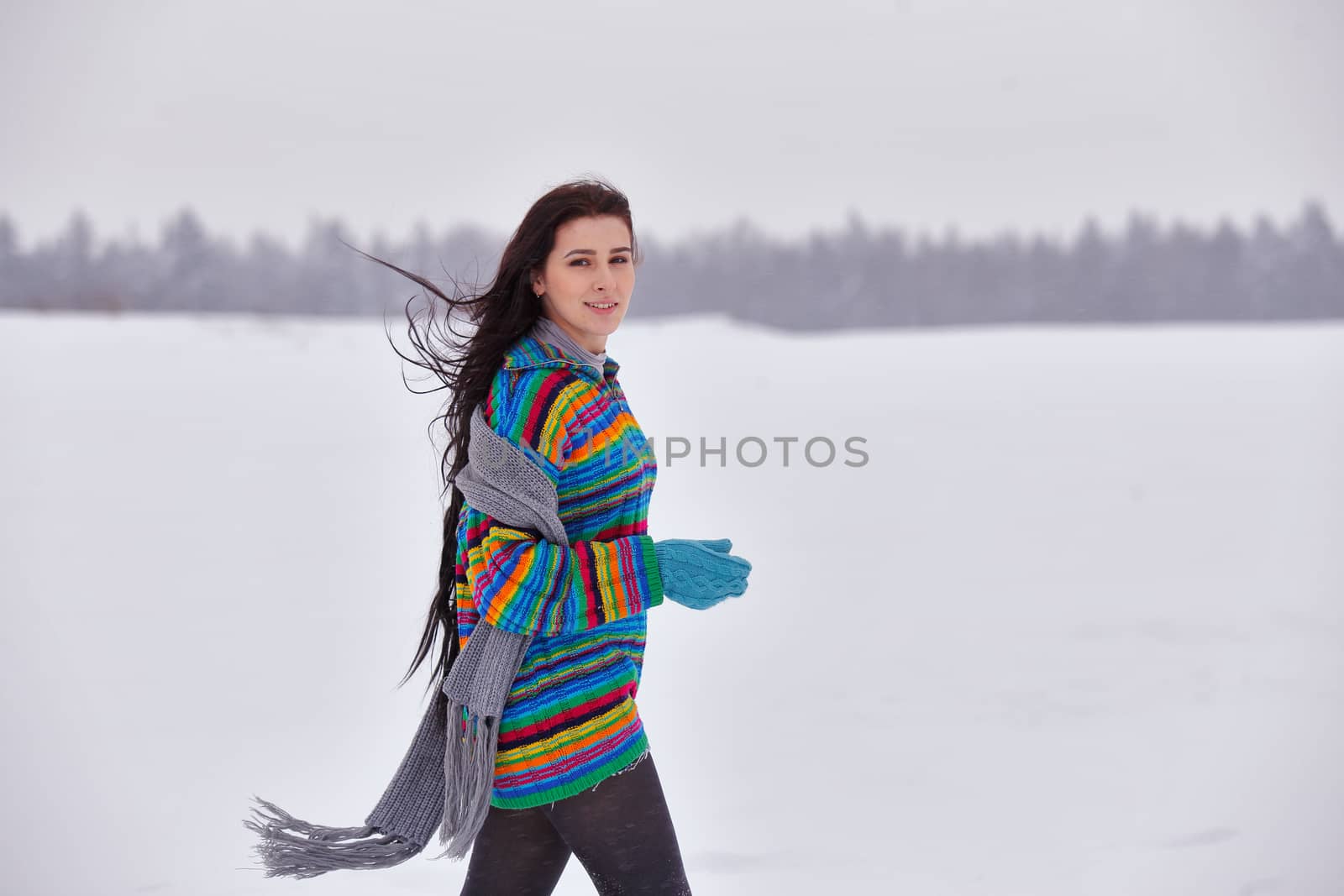 Beautiful girl in a sweater on a winter walk, Belarus